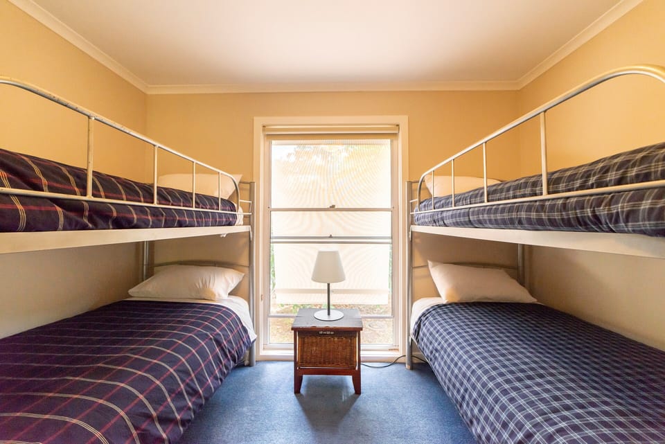 Bedroom 2: Versatile and cozy with two bunk beds. Perfect for families or groups.