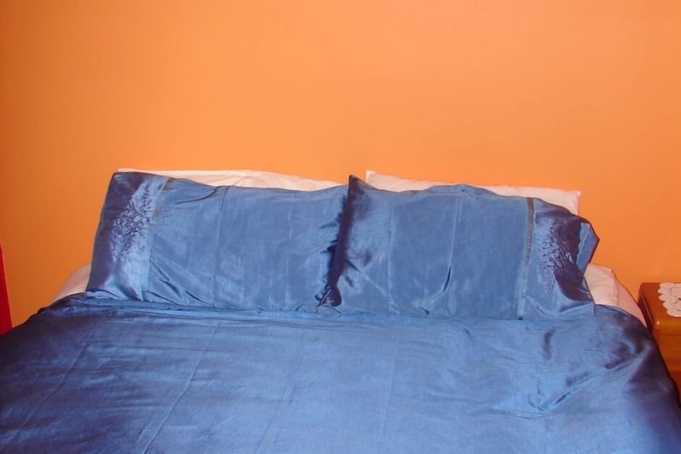 Kingsized bed in bedroom