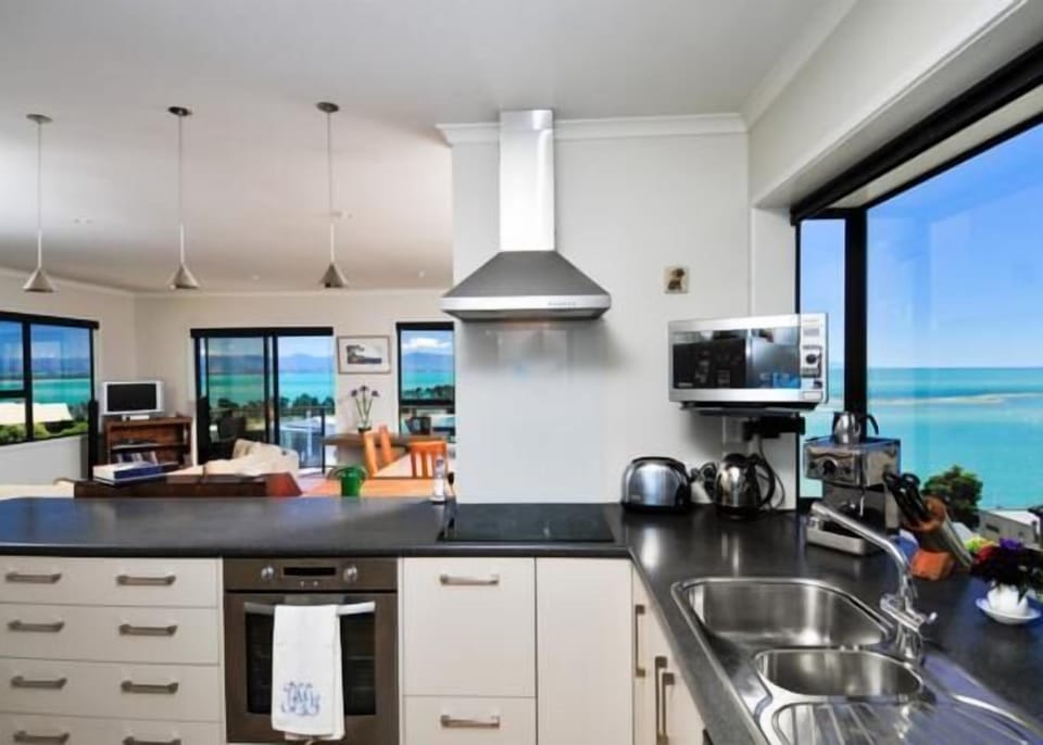 Fully-equipped kitchen with espresso machine