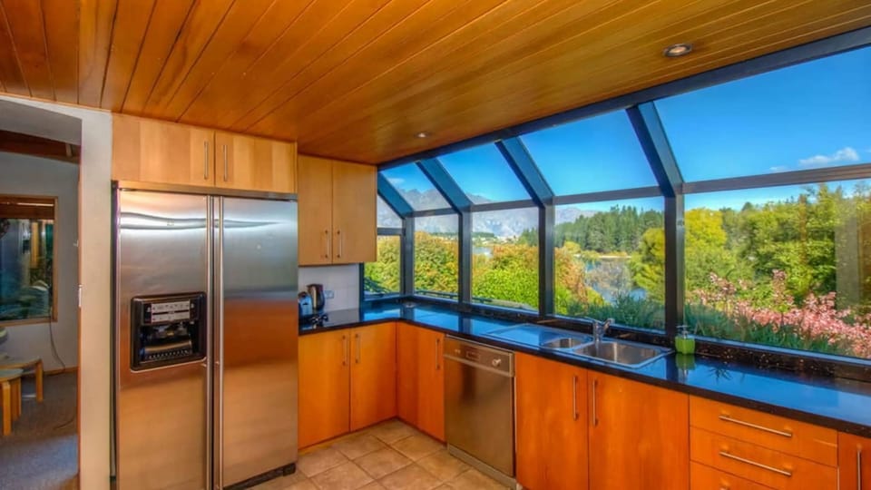 Full kitchen with brilliant lakefront and mountain views