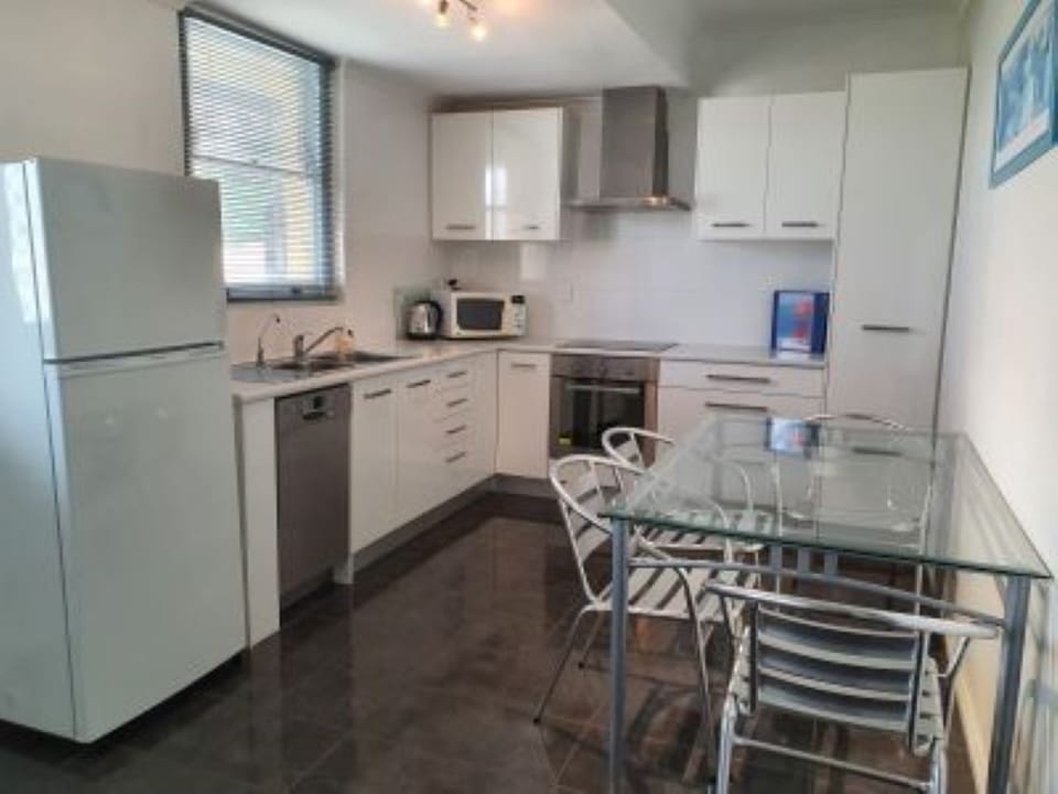 Kitchen/Dine with dishwasher, fridge, crockery, cutlery pots and pans 