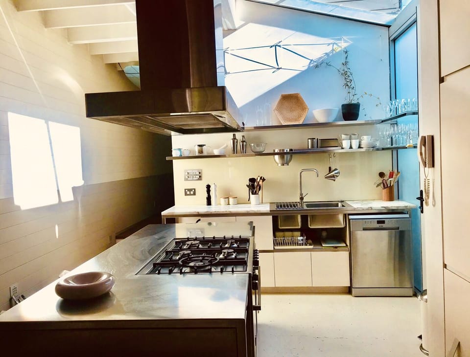 kitchen with central stainless steel gallery 

