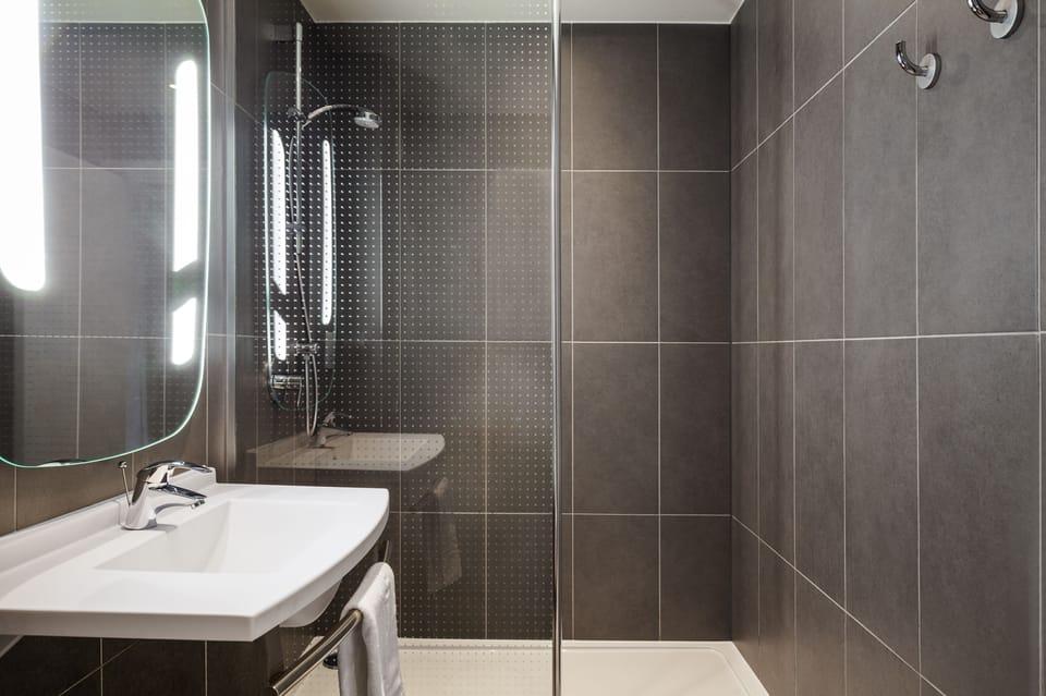 Shower, eco-friendly toiletries, hair dryer, towels