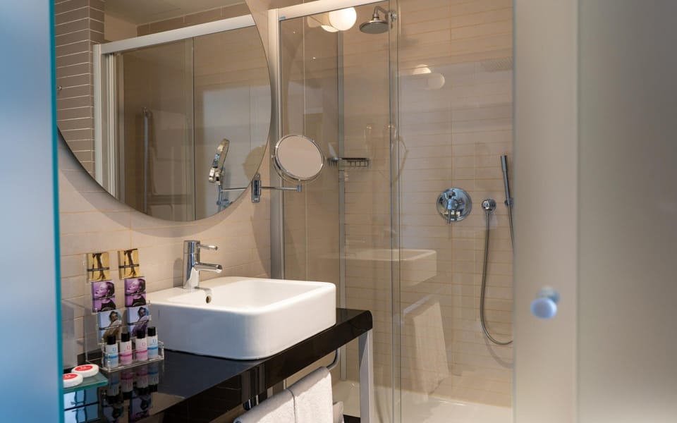 Designer toiletries, hair dryer, bidet, towels