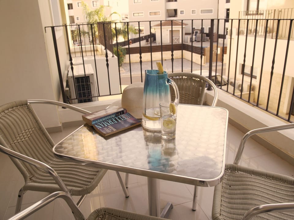 Balcony with side pool view