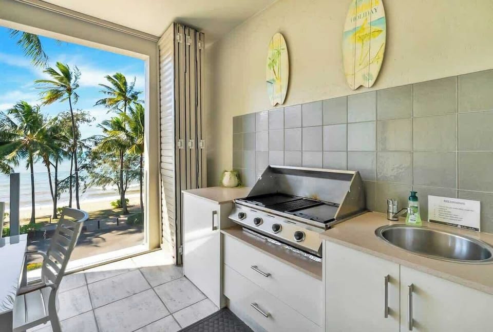 Fire up the built-in BBQ and make the most of effortless outdoor cooking, complete with a sink and prep area—perfect for laid-back seaside dining.