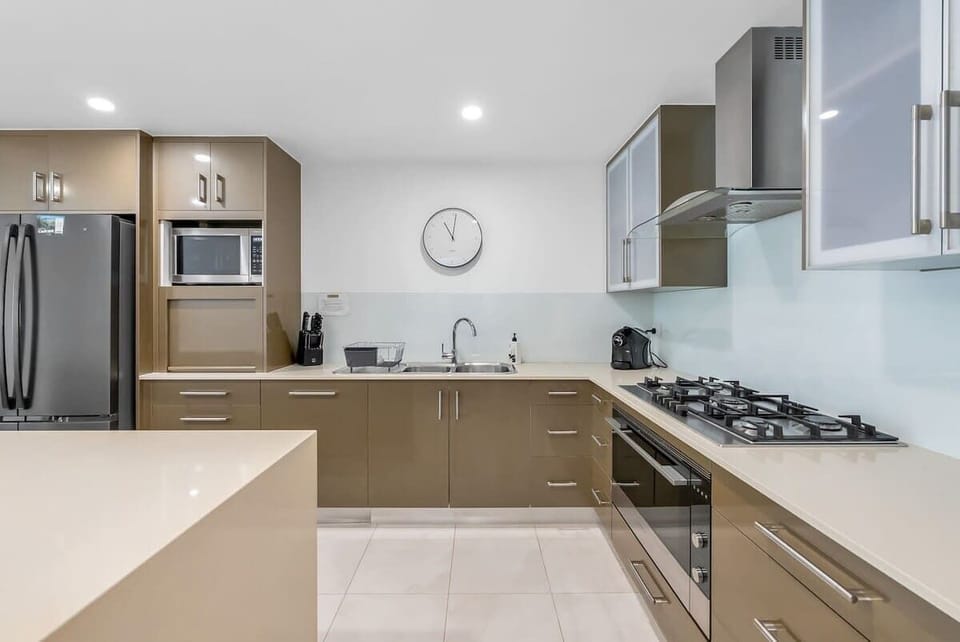 Cook up local produce in the fully equipped kitchen, featuring a gas cooktop, oven, fridge, dishwasher, and all the modern conveniences.