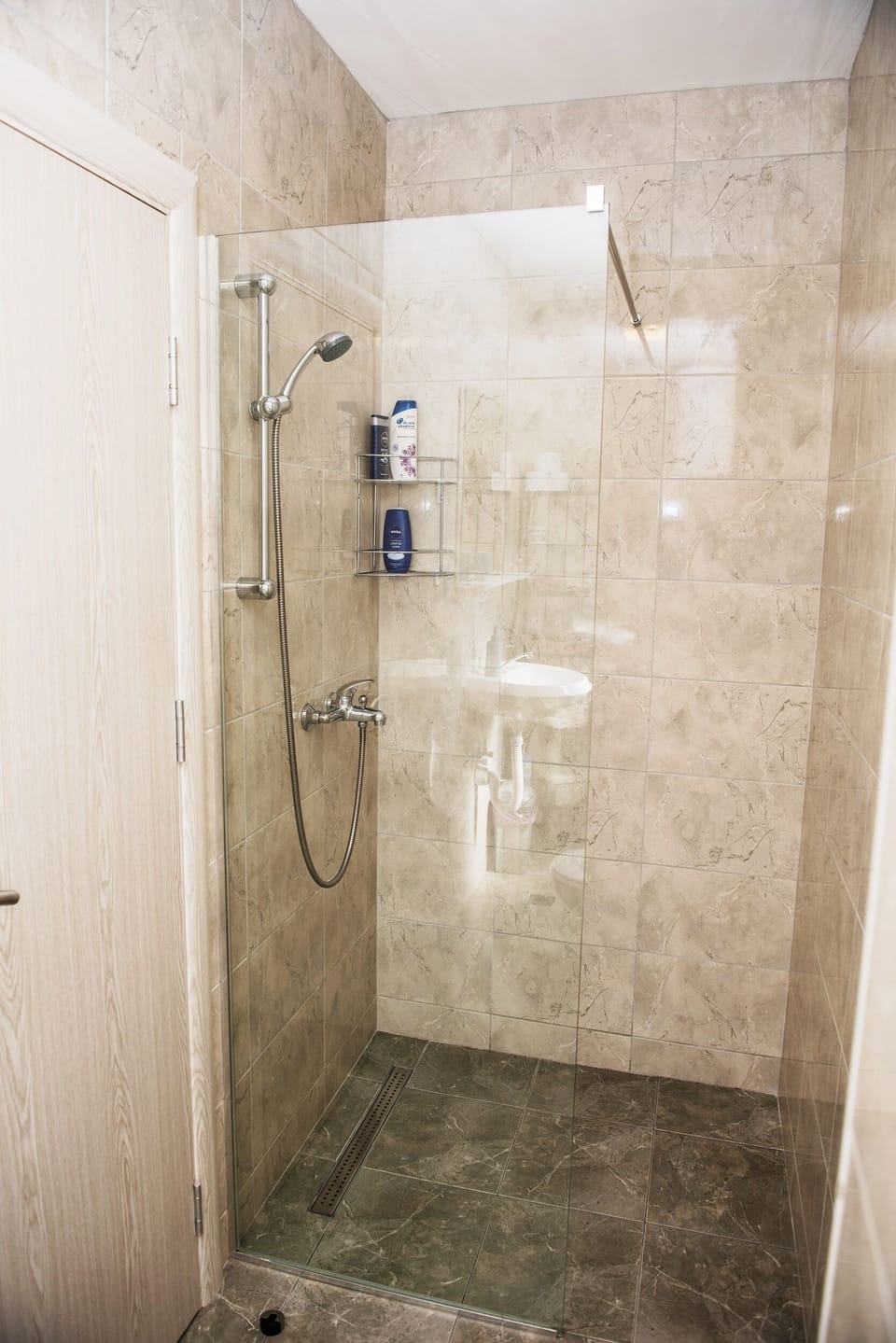 Shower with shampoo and shower gel provided 