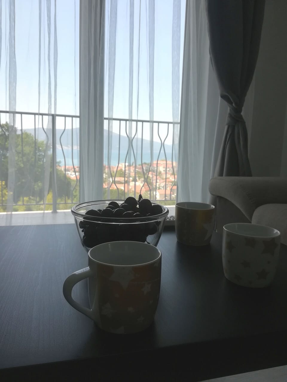 Having a coffee with view from sofa bed in living room 