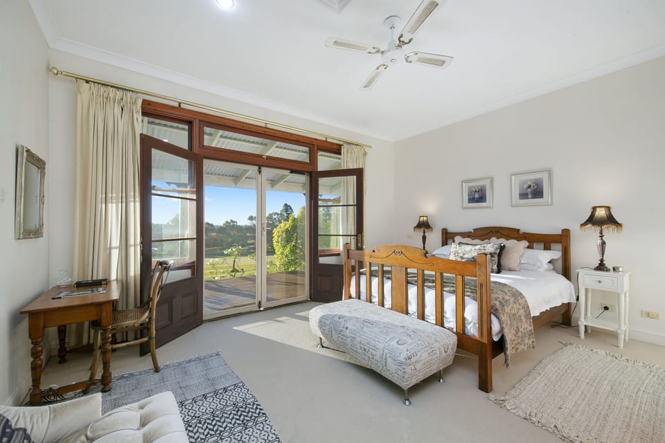 Master bedroom with ensuite bathroom and walk-in robe & french doors