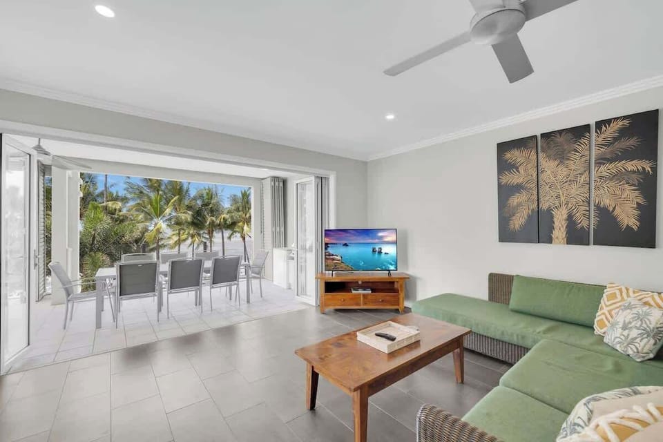Kick back on the wicker lounge in the first living room with a spot of TV in air-conditioned comfort.