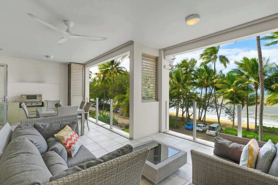 The balcony offers a cosy sofa setting to settle in with your favourite book while enjoying beachfront views.