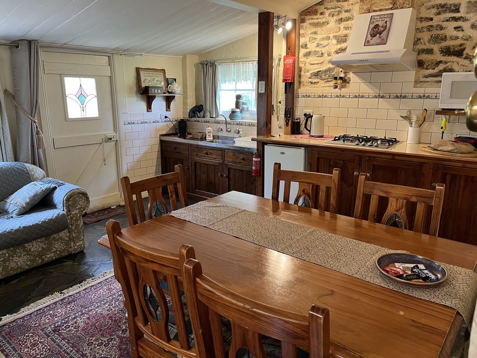 Eat in kitchen, table seats up to five.  Sofa in kitchen converts to bed