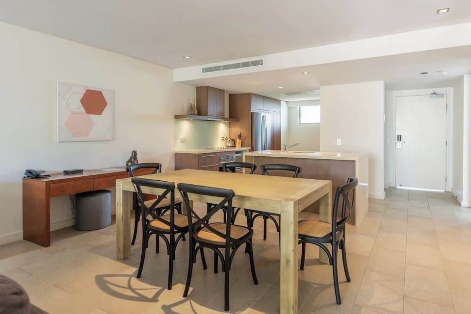 Dine inside at the stylish timber table, or opt for alfresco meals on your private rooftop terrace.