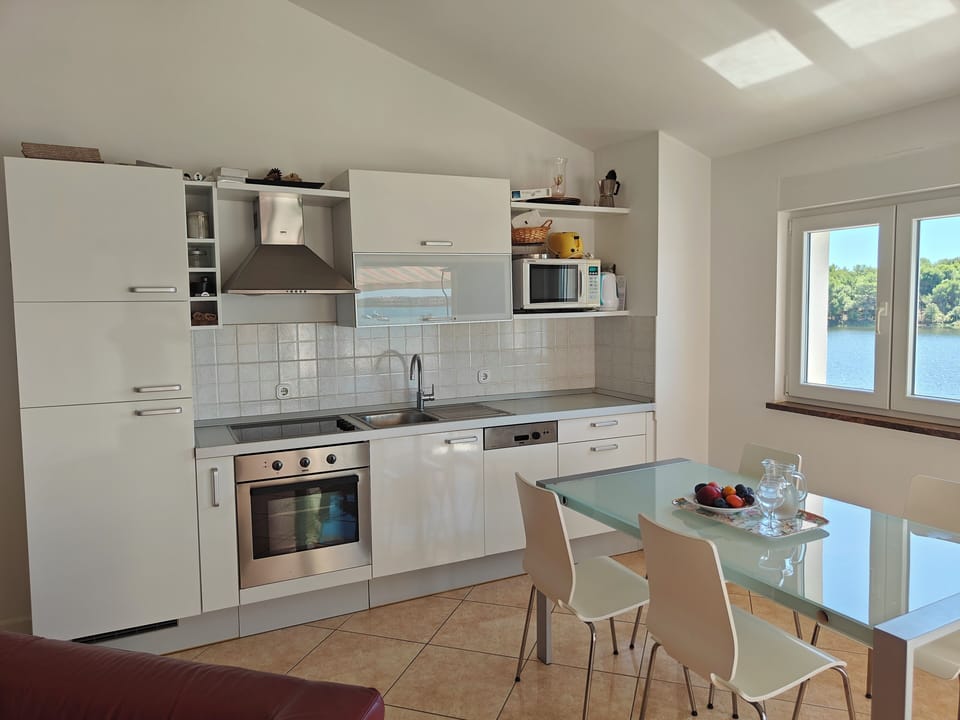 Well appointed spacious kitchen with ceramic hob, oven, microwave and dishwasher