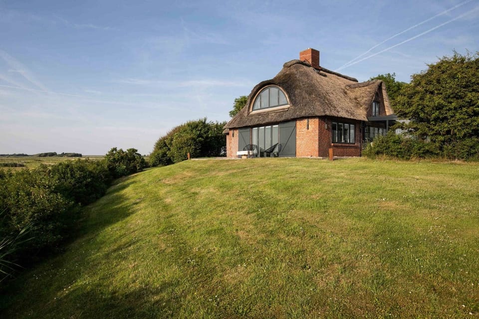 Thatched house on the warft mound