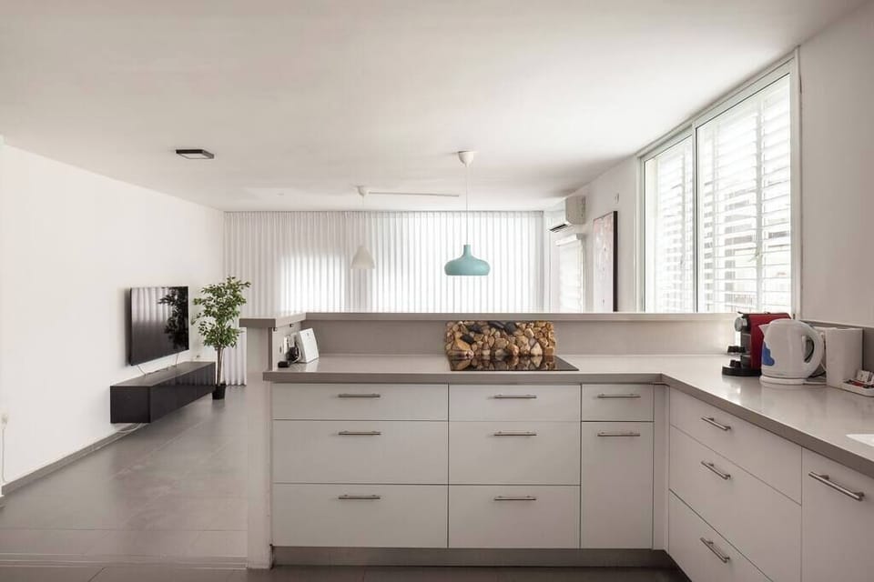 Fully equipped kitchen supports effortless cooking, ideal for extended stays and shared meals at home.