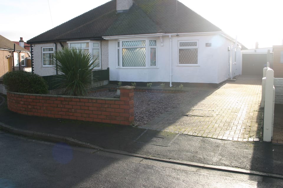 Front view showing paved drive for off rd parking