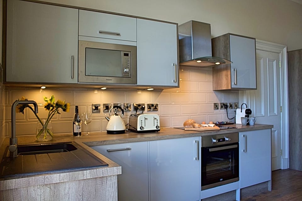 Modern fitted kitchen with all mod cons including a pod coffee machine