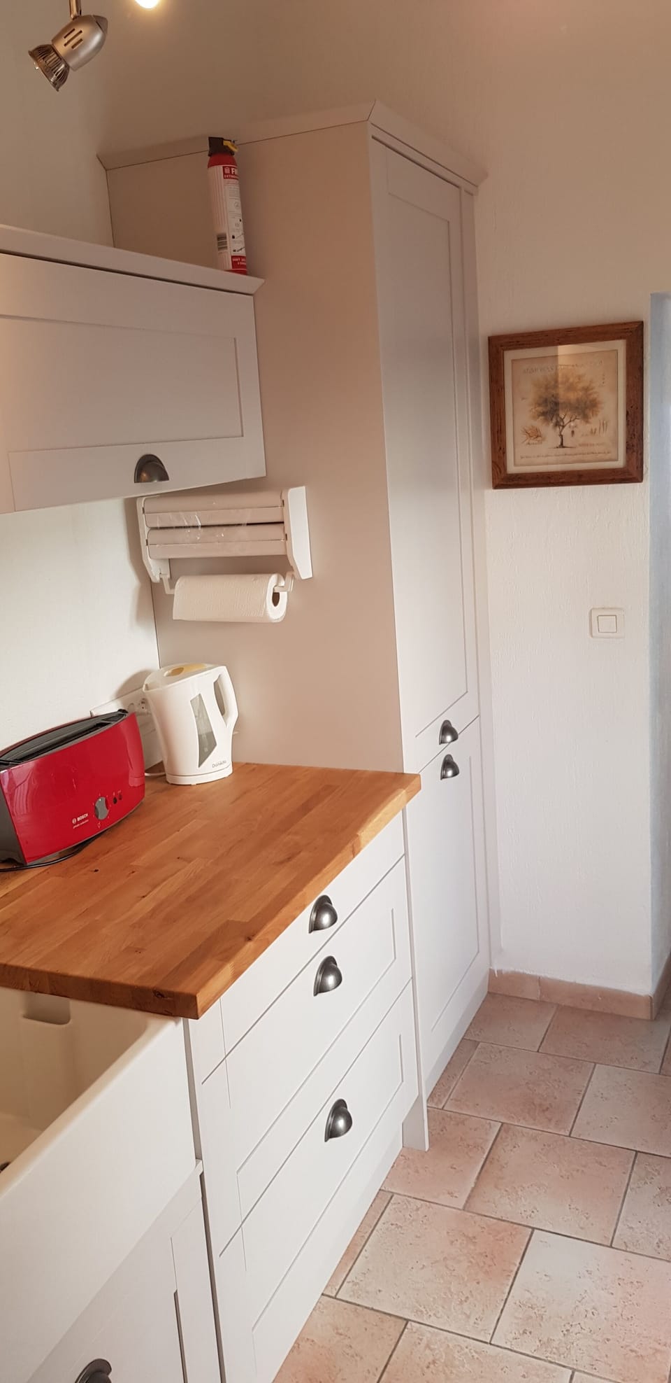 A fully equiped kitchen with fridge/freezer and doors onto a small balcony. 