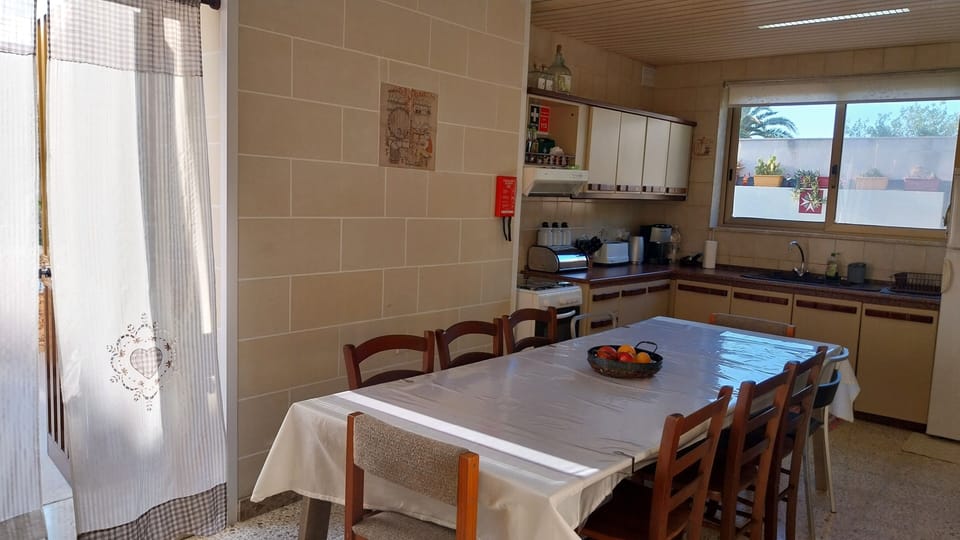 Kitchen & Dining table extendable to sit 12 max.