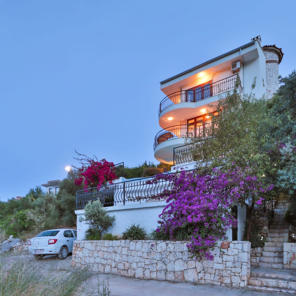 Front of villa showing parking and steps up to villa