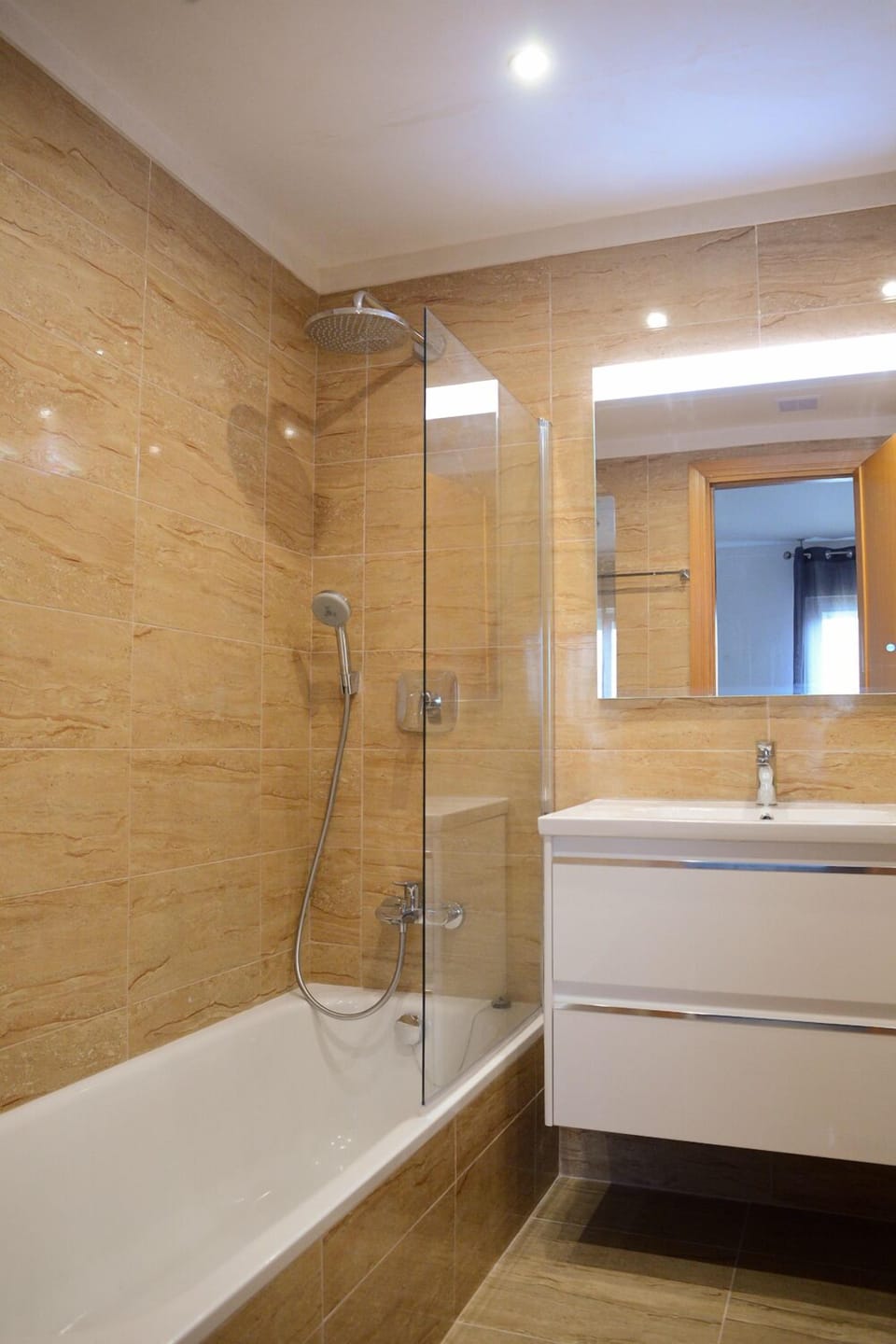 Large ensuite - shower over bath also hand shower. Demist mirror. Shaver point. 