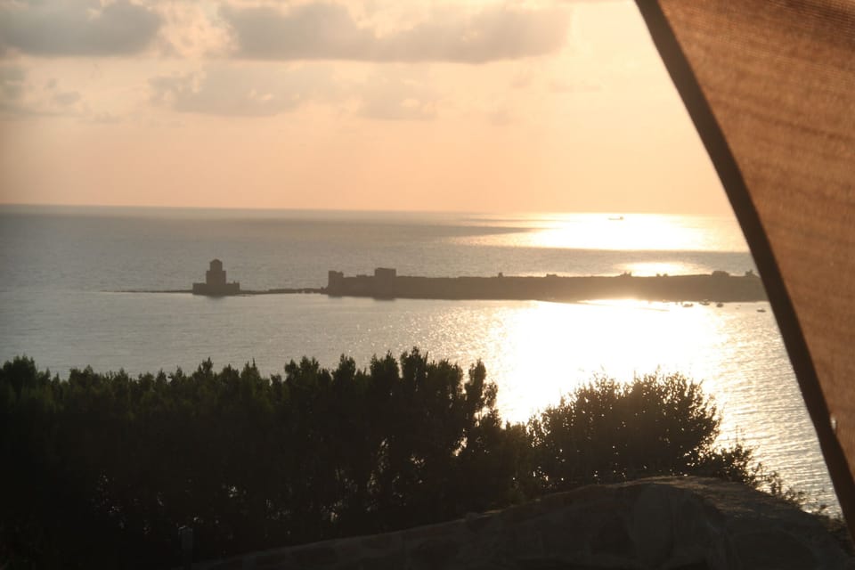 frontal view of the sea, the village and the fortress
