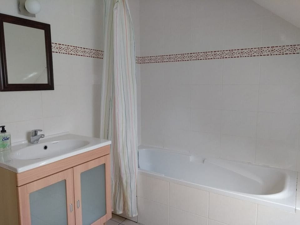 First floor family bathroom with bath and overhead