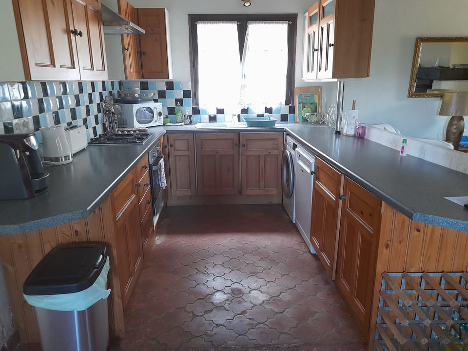 Kitchen with Tassimo coffee maker, slow cooker, toaster, and air fryer