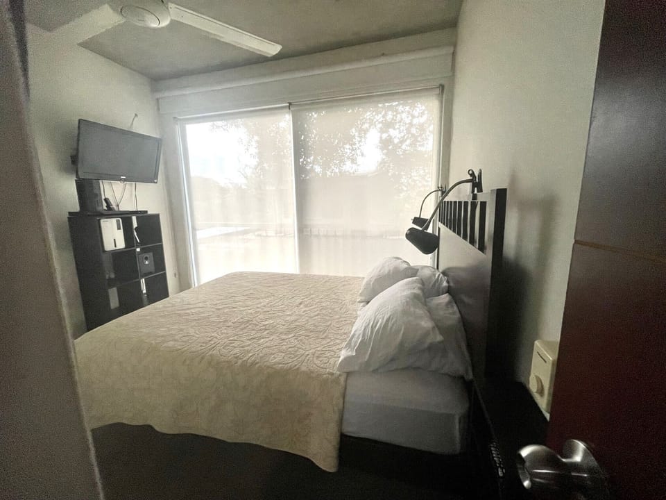 Secondary bedroom view, with different bedding and extra pillows.