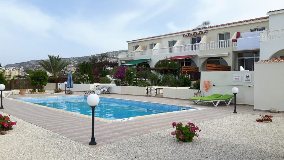 POOL AND THE SURROUNDING AREA.