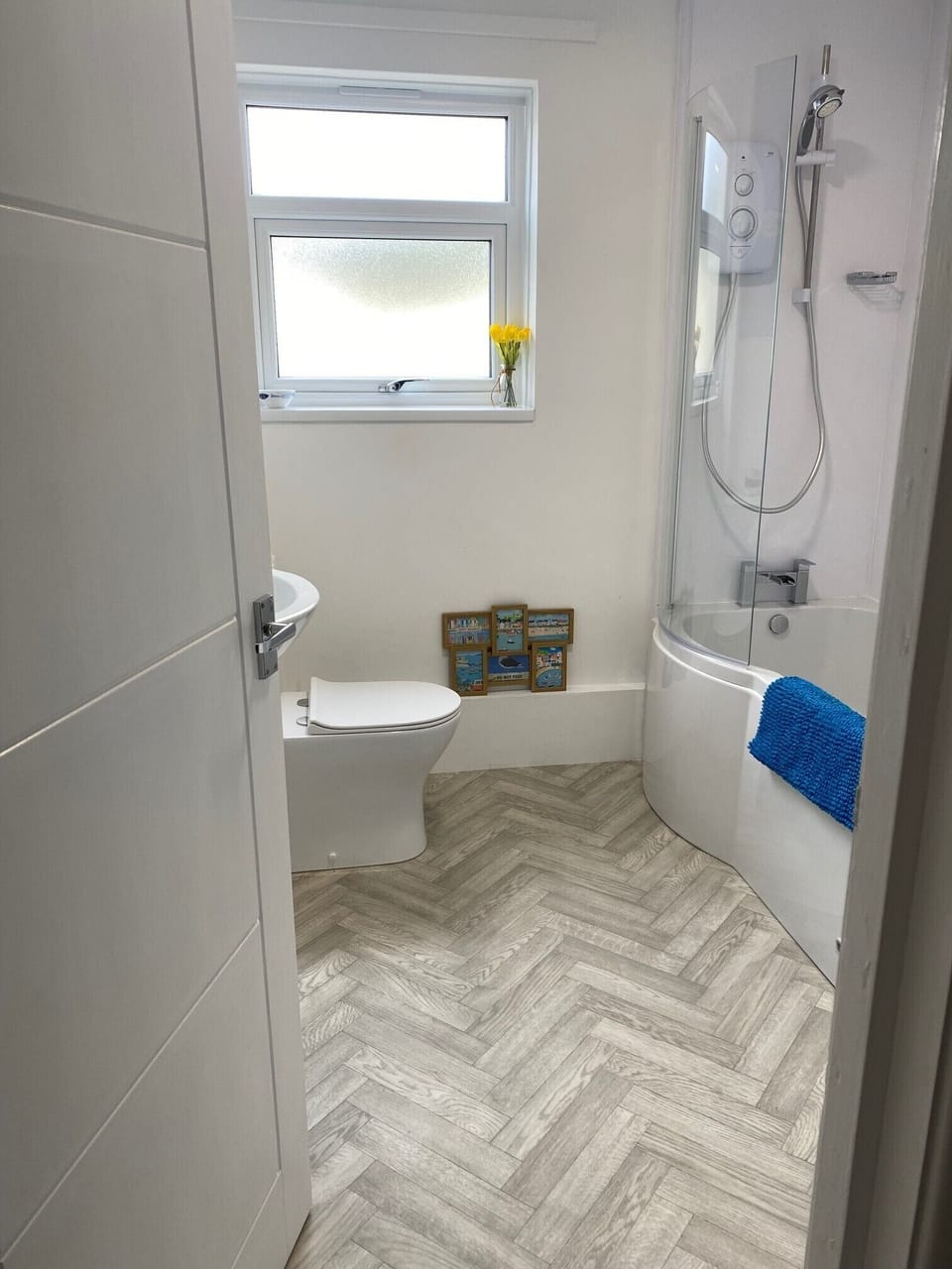New bathroom for 2022, spacious with new bath and overhead shower 