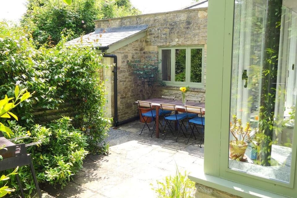 The outdoor eating area includes a barbeque in the private courtyard.