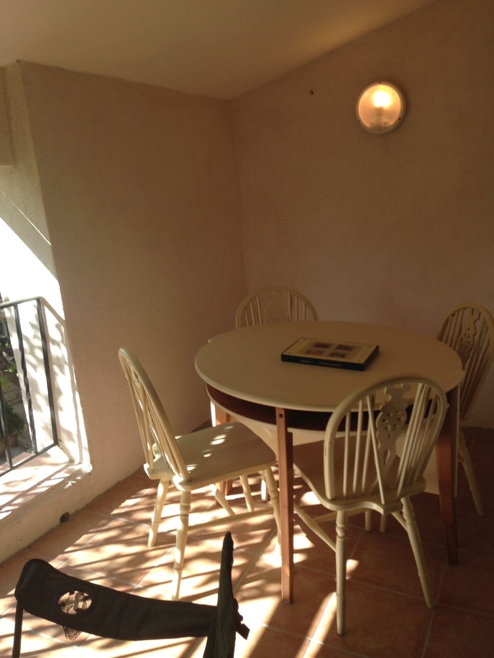 Table extends to seats 6 and can be pulled into the middle of the balcony.
