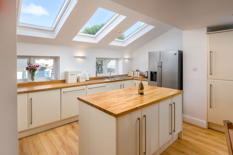Kitchen with skylights at Foreshore large family house Bude