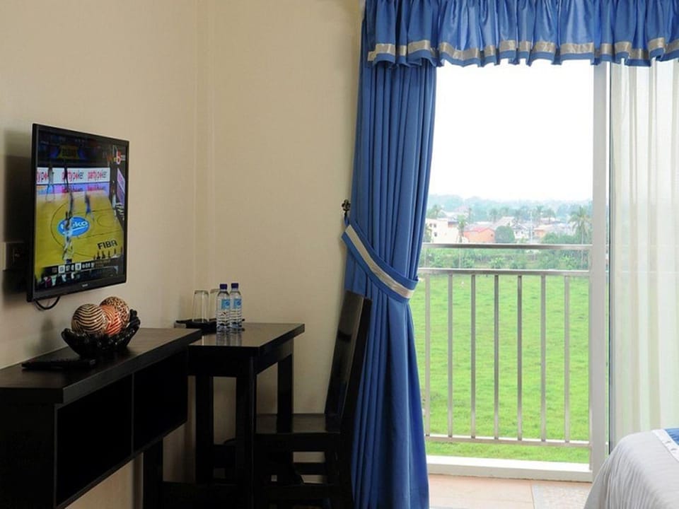 Desk, laptop workspace, blackout drapes, iron/ironing board