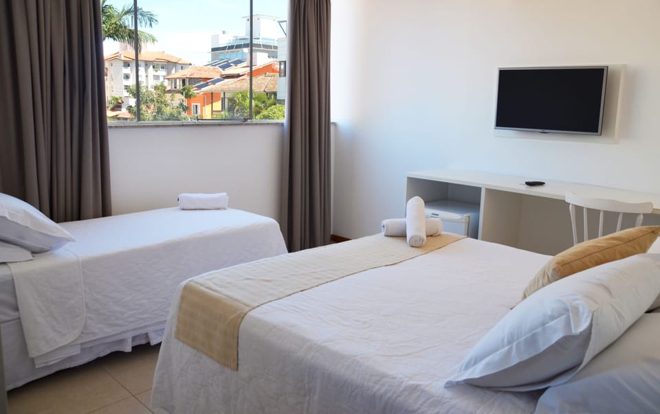 Deluxe Triple Room | Minibar, in-room safe, free WiFi, bed sheets