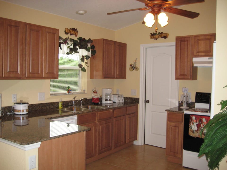 Light,well equipped kitchen with granite counter tops.