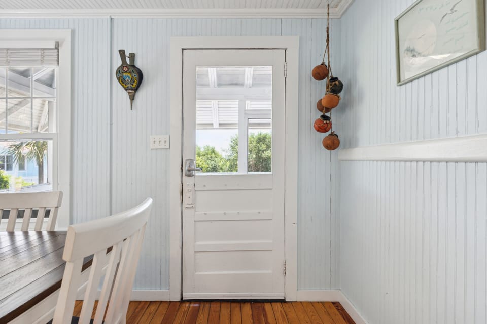 Access to the screened in patio is just off the dining room on the upper level.