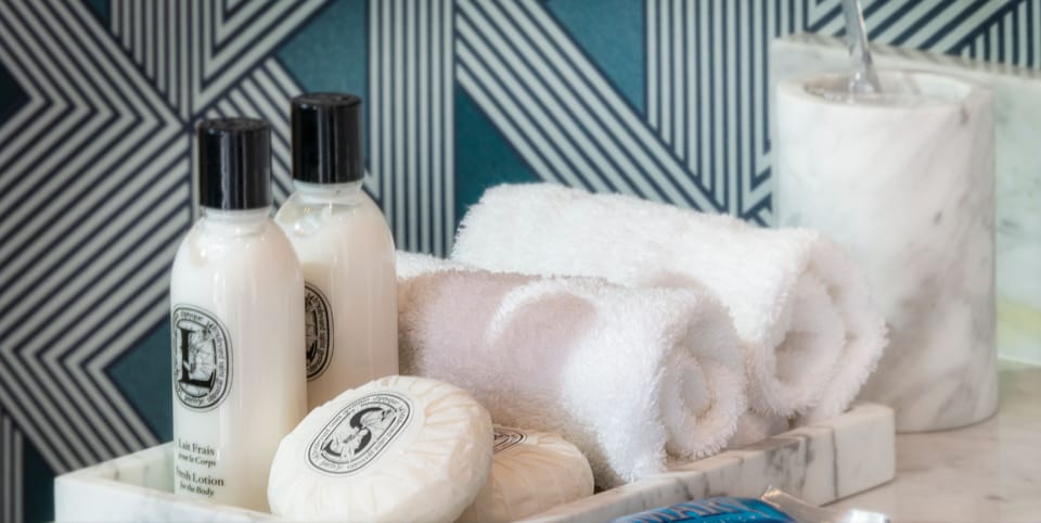 Presidential Suite | Bathroom | Designer toiletries, hair dryer, bathrobes, slippers