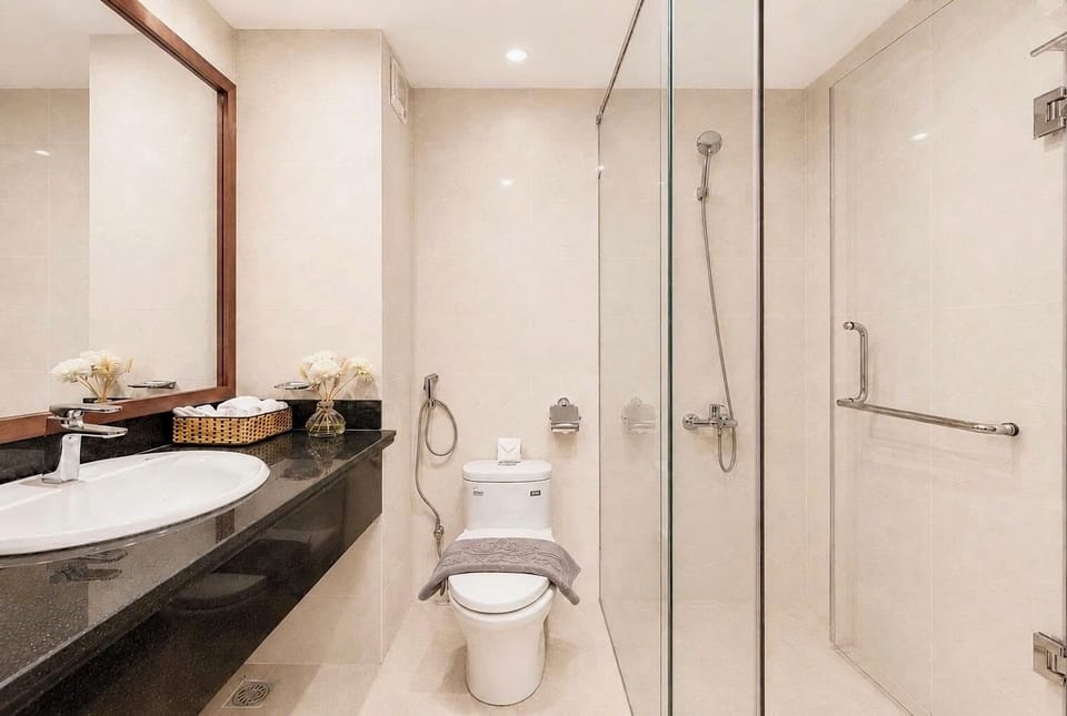 Separate tub and shower, designer toiletries, hair dryer, slippers