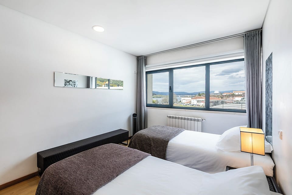Twin Room, River View | 20 bedrooms, blackout drapes, free WiFi, bed sheets