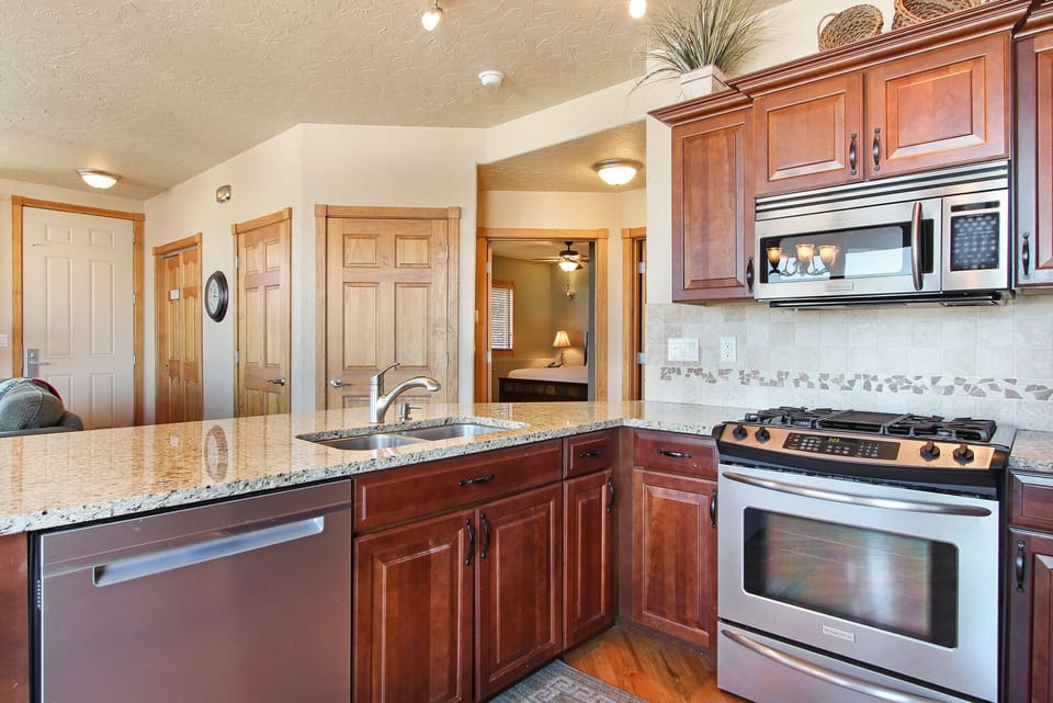 Condo, 2 Bedrooms | Private kitchen | Fridge, microwave, oven, dishwasher