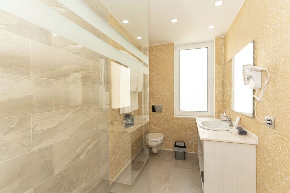 Quadruple Room, Sea View | Bathroom | Shower, free toiletries, bidet, towels