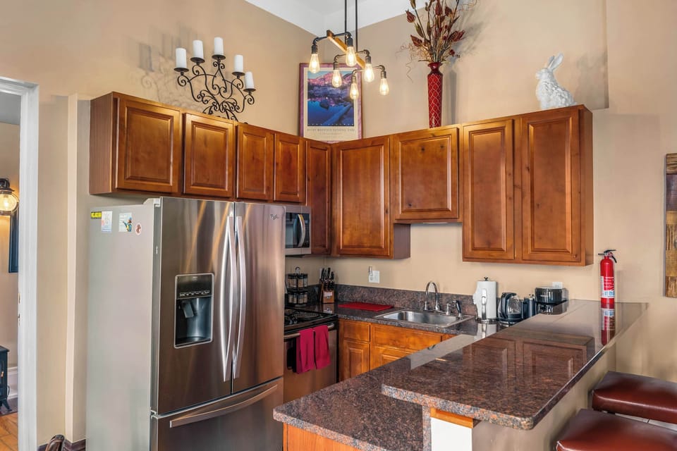 【Kitchen】 Fully stocked — GE stainless range, full-size fridge, dishwasher, everything for 4