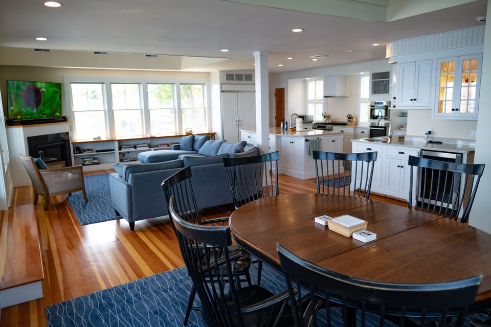 Dining table looking into the kitchen and living room 
