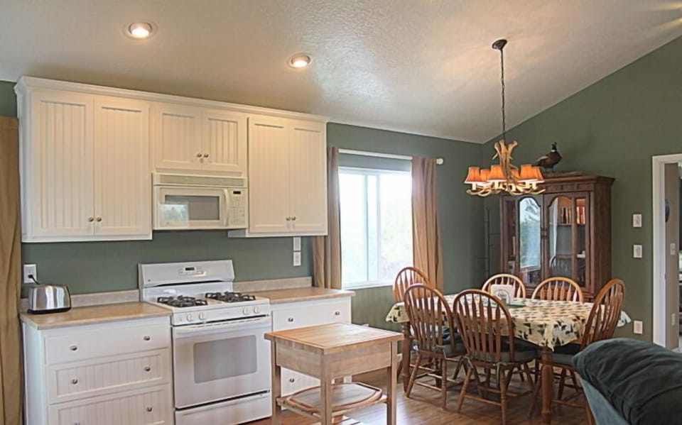 Cooking side of kitchen & dining area.