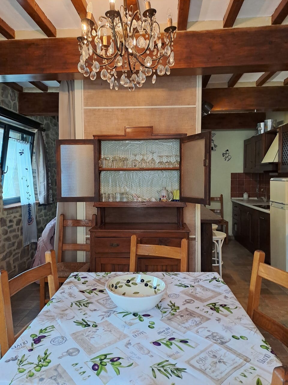 The dinner table, cupboard,  a sofa bed, at ground floor