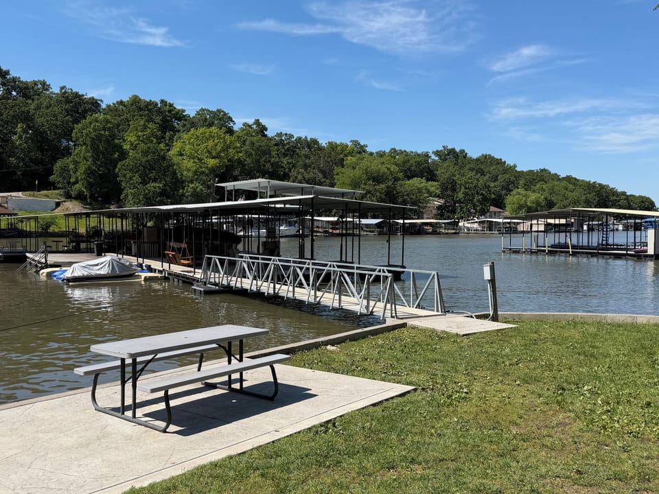 Community dock.  Deep off main channel in very calm water.  Great swimming area